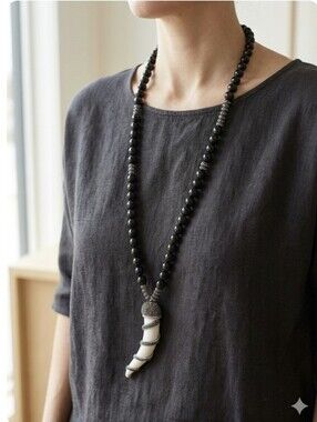 Elegant Black Bead Necklace with White Horn Pendant
